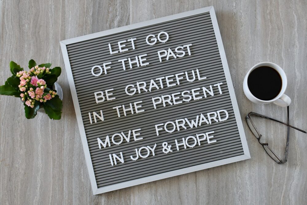 Let Go of the Past, Be Grateful in the Present, Move Forward in Joy & Hope - message board sign